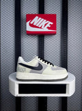 Low-top leather and textile sneaker in sail and grey