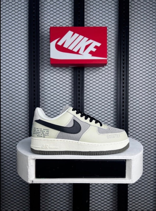 Low-top leather and textile sneaker in sail and grey