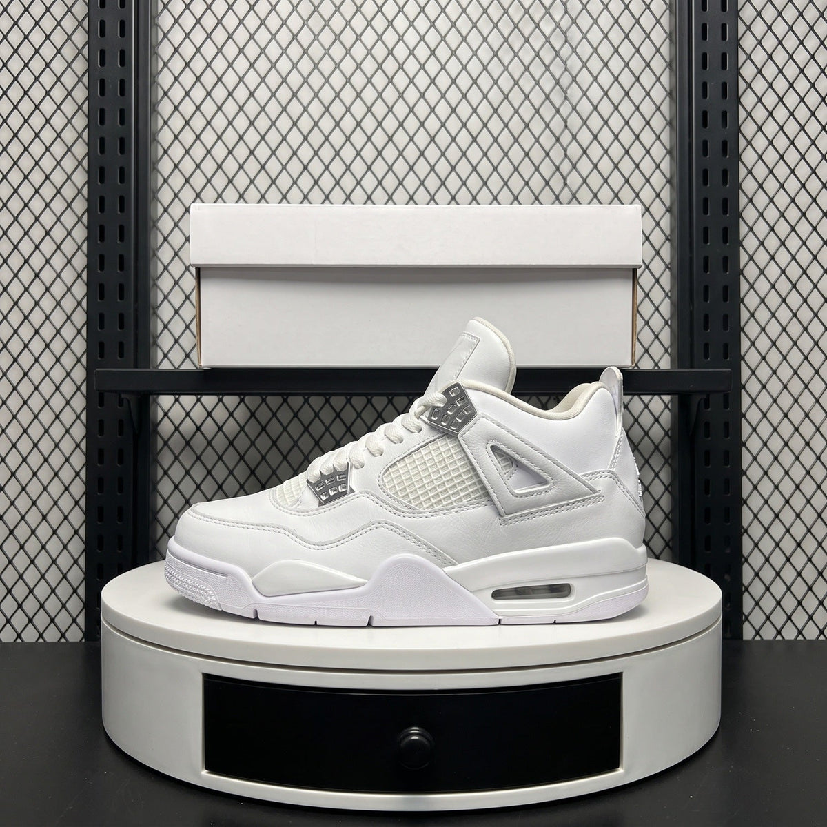 Monochrome white leather high-top with metallic eyelets
