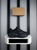 Triple black mesh runner with sculpted cutout midsole