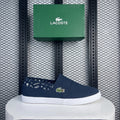 White-sole navy canvas slip-on shoe with printed lining