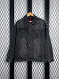 Denim trucker jacket with distressed cross jacquard pattern