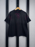 Paneled cotton T-shirt with neon pink paint splatters