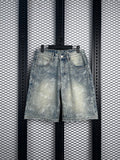Acid-wash floral-etched denim shorts in light blue