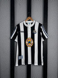 Black and white striped jersey with grandad collar