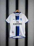 Blue-trimmed white football jersey with vertical center stripe