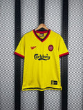 V-neck football silhouette in yellow with striped collar