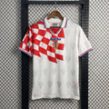 Checkerboard drape-panel collared football jersey in white and red