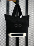 Black textured fleece tote with matching shoulder straps