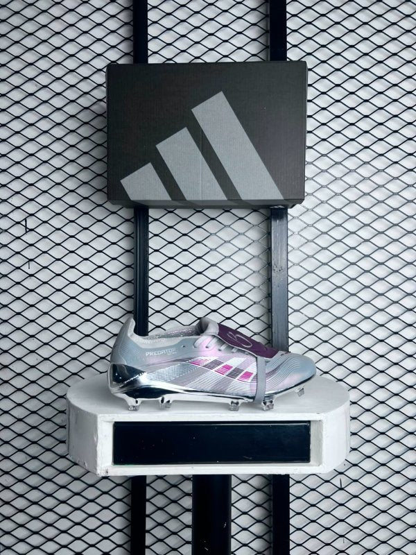 Fold-over tongue football boot with chrome soleplate