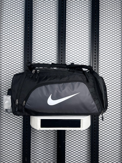 Black and charcoal two-tone duffel bag with front zip