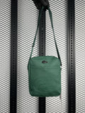 Coated canvas shoulder pouch in dark green