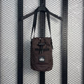 Mesh-pocket toggle crossbody bag in espresso nylon