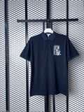 Navy pique polo with tennis court chest graphic