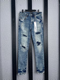 Patchwork distressed slim-fit jeans in washed blue denim