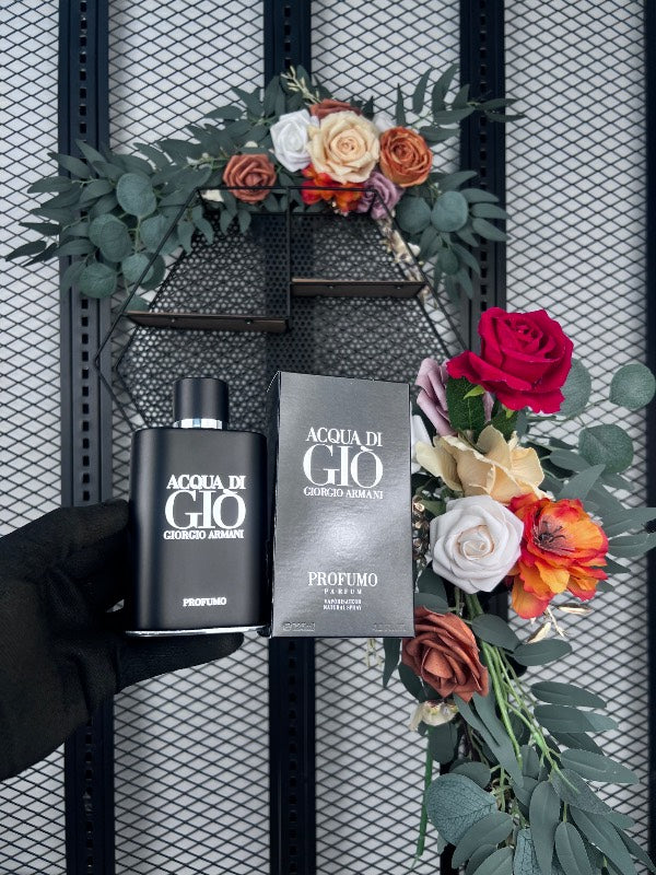 Matte black glass fragrance bottle with silver accents