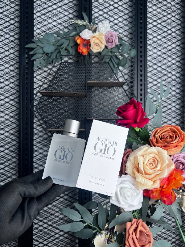 Frosted glass fragrance bottle with silver-tone cap