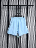 Elastic-waist drawstring sweat shorts in light baby blue
