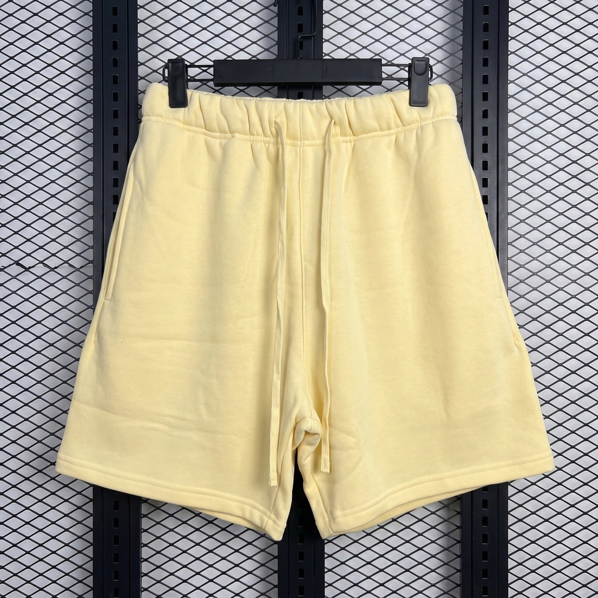 Fleece drawstring sweat shorts in pale pastel yellow