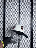 SL cap cream and black