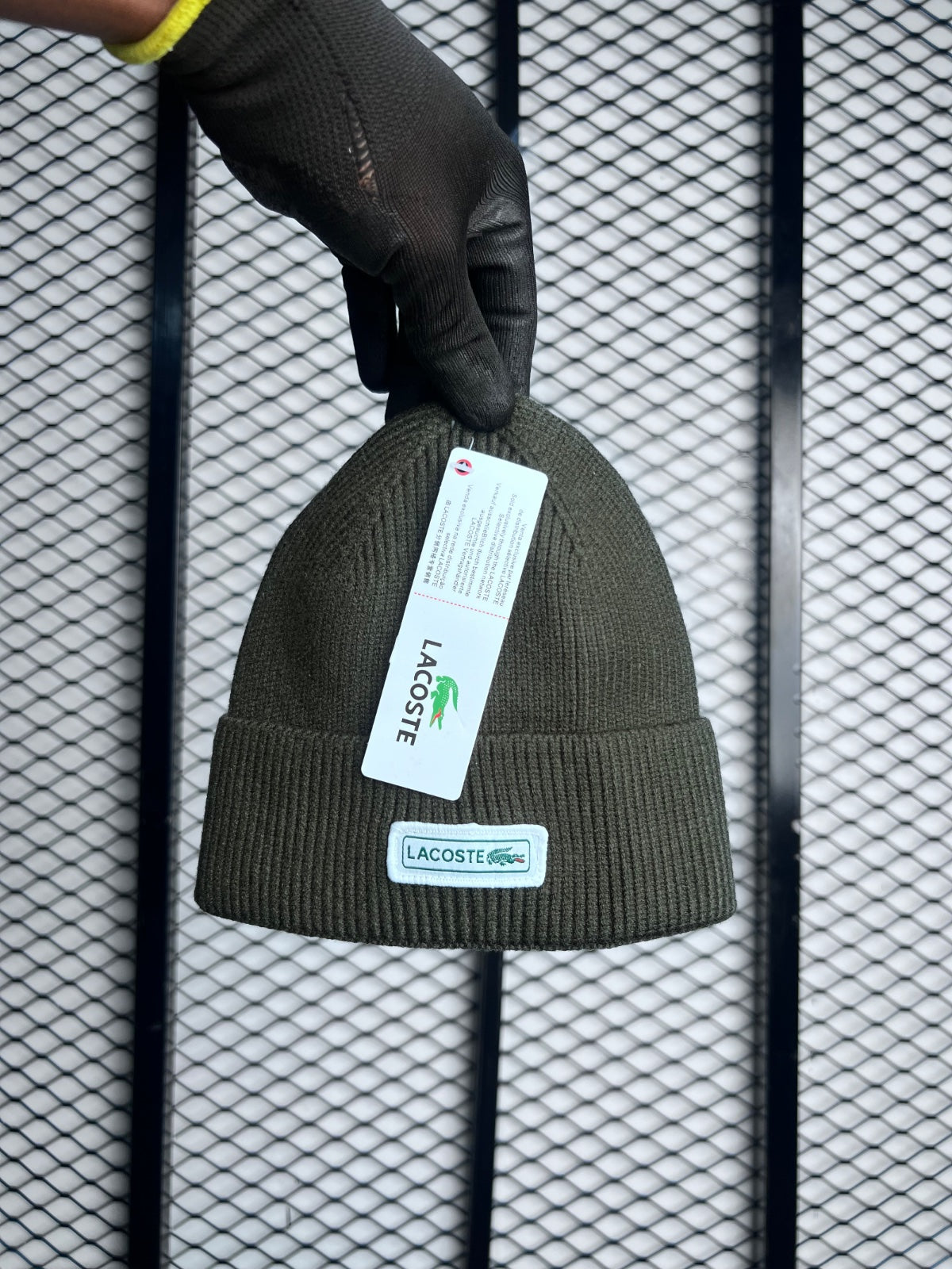 Green beanie with white logo